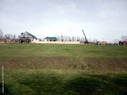 one-story houses car crane excavator