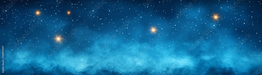 Obraz premium A mesmerizing starry night sky filled with twinkling stars and ethereal blue clouds.