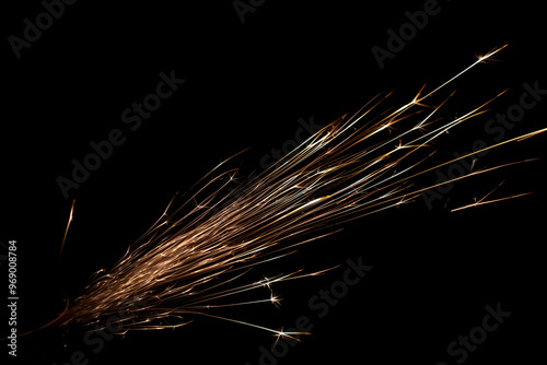 sparks from the grinder glowing in the dark