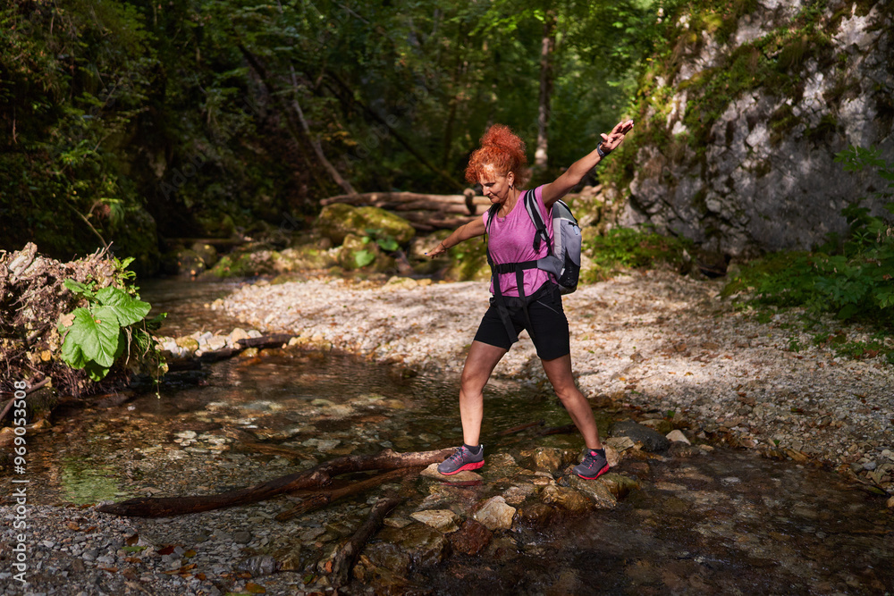 Woman hiker by the river Woman hiker by the river