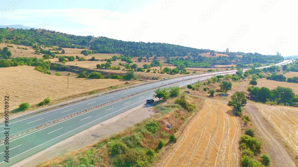 Highway with a truck driving down it. Highway with a truck driving down it.