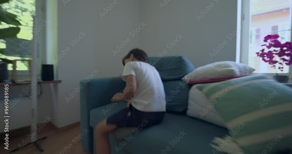 Child running into a bright living room through an open door, energetic movement in a home environment, highlighting the playfulness and activity of childhood Child running into a bright living room through an open door, energetic movement in a home environment, highlighting the playfulness and activity of childhood