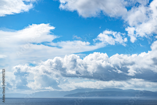 Fototapeta Naklejka Na Ścianę i Meble -  blue sky with big clouds over the sea 