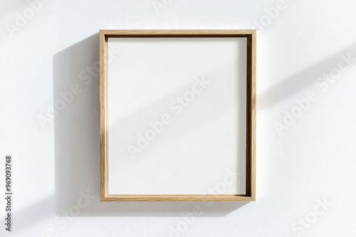 Minimalist mockup of an empty, blank wooden frame on the wall, with dried flowers next to it. Created with Ai