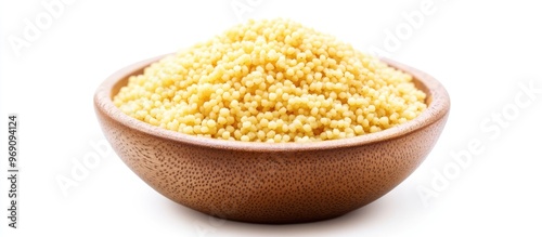 Raw organic couscous in a bowl on a white background with copy space photo