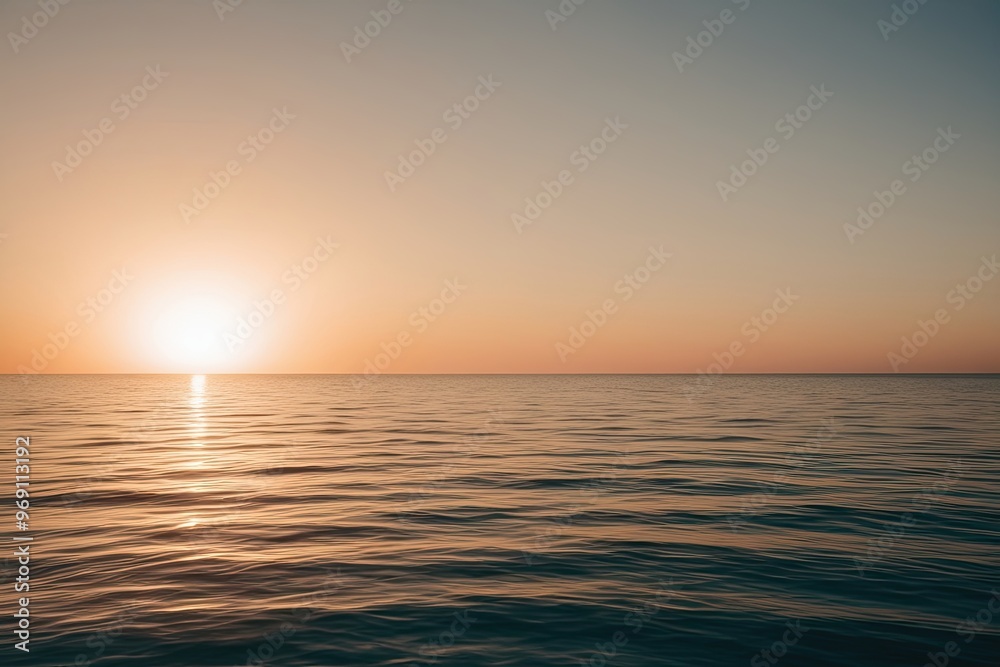 Obraz premium Radiant Sunset on a Glassy Sea with Minimalistic Background