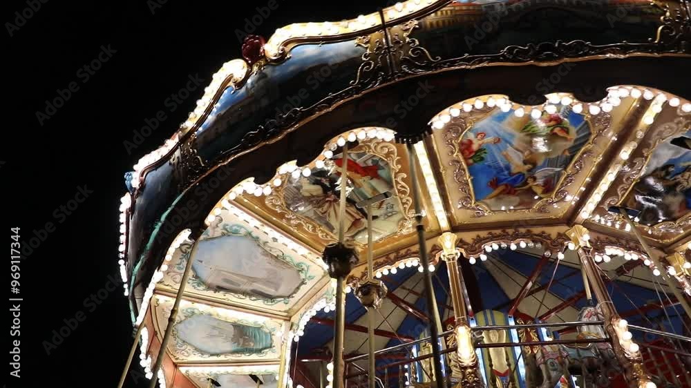 Tirana, Albania. Carousel attraction spinning at night. Illumination of a carousel.