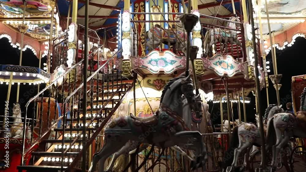 Tirana, Albania. Carousel attraction spinning at night. Illumination of a carousel.