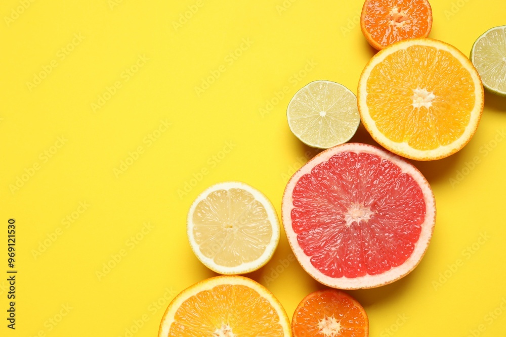 Tropical fruits on a colored background. Summer concept. Flat lay, top view, copy space Tropical fruits on a colored background. Summer concept. Flat lay, top view, copy space