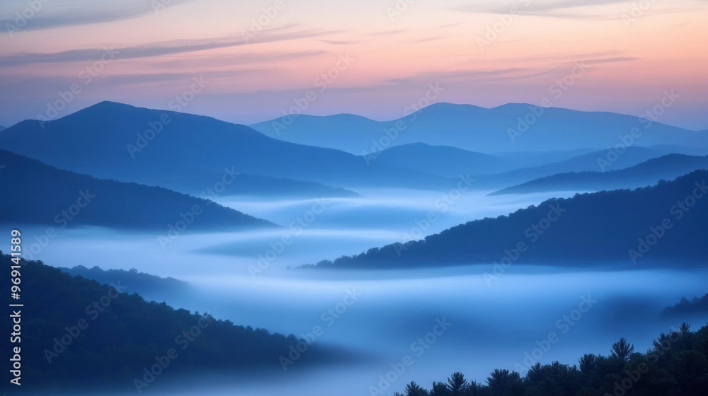 Serene mountains shrouded in mist during twilight, creating a tranquil landscape. Serene mountains shrouded in mist during twilight, creating a tranquil landscape.