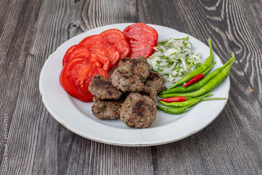 The famous Milas meatballs are made with tomatoes, onions, red and green peppers.