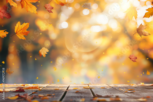 Wooden table with an autumn background and blurred golden-yellow bokeh light, with falling leaves in the air