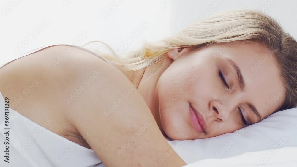 Peaceful, serene scene of a young woman sleeping comfortably in bed, with soft, natural lighting. Perfect for themes of relaxation, rest, and tranquility. Peaceful, serene scene of a young woman sleeping comfortably in bed, with soft, natural lighting. Perfect for themes of relaxation, rest, and tranquility.