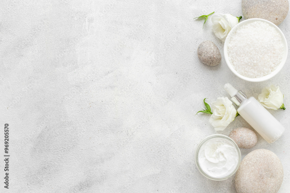 Spa set with white roses and blank bottles of skin care cosmetics Spa set with white roses and blank bottles of skin care cosmetics