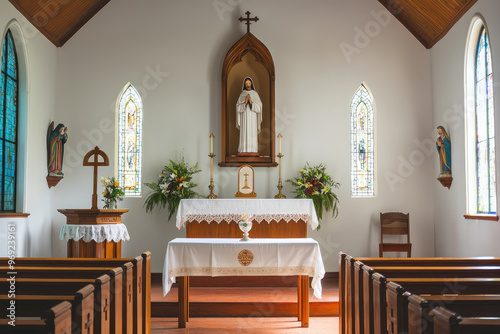 A serene interior of Catholic church featuring an altar and stained glass