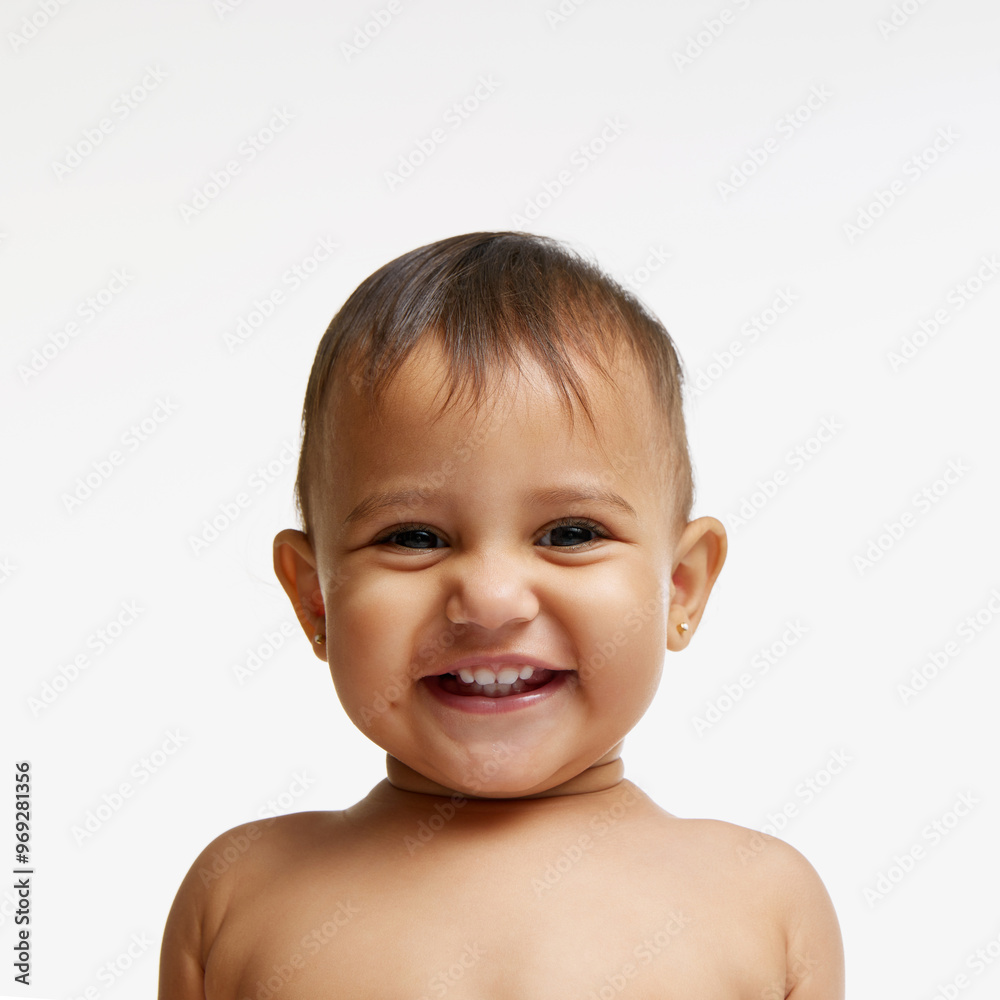 Portrait of happy little girl, baby with tiny gold earrings, cheerfully smiling isolated on white studio background. Innocence. happiness, joy. Concept of childhood, parenthood, care Portrait of happy little girl, baby with tiny gold earrings, cheerfully smiling isolated on white studio background. Innocence. happiness, joy. Concept of childhood, parenthood, care