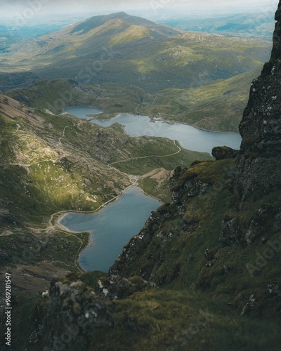 Fototapeta Naklejka Na Ścianę i Meble -  Stunning aerial view of Snowdonia National Park featuring rugged mountains and tranquil lakes
