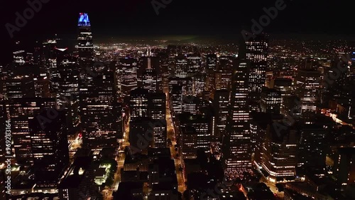 Drone footage of San Francisco skyline at night with the city lights in California