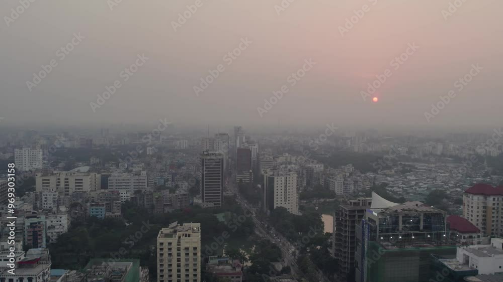 Drone cityscape view of Dhaka at sunset time with a heavy fog in Bangladesh Drone cityscape view of Dhaka at sunset time with a heavy fog in Bangladesh