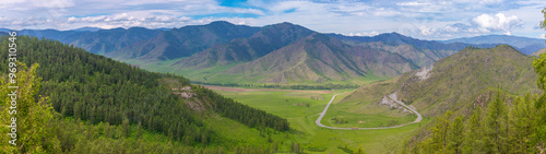 Panorama landscape from the Chike-Taman mountain pass in the northern direction with serpentine mountain road in Altai Republic, Russia. Chike-Taman Pass is a natural monument of the Altai Republic