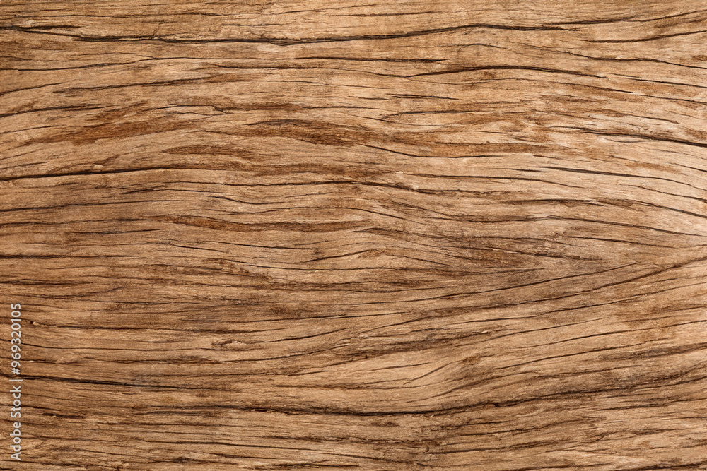 Close-up of a rustic brown wooden surface with a natural grain pattern. Close-up of a rustic brown wooden surface with a natural grain pattern.