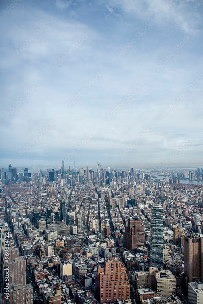View of New York City skyline with skyscrapers and clear blue sky View of New York City skyline with skyscrapers and clear blue sky