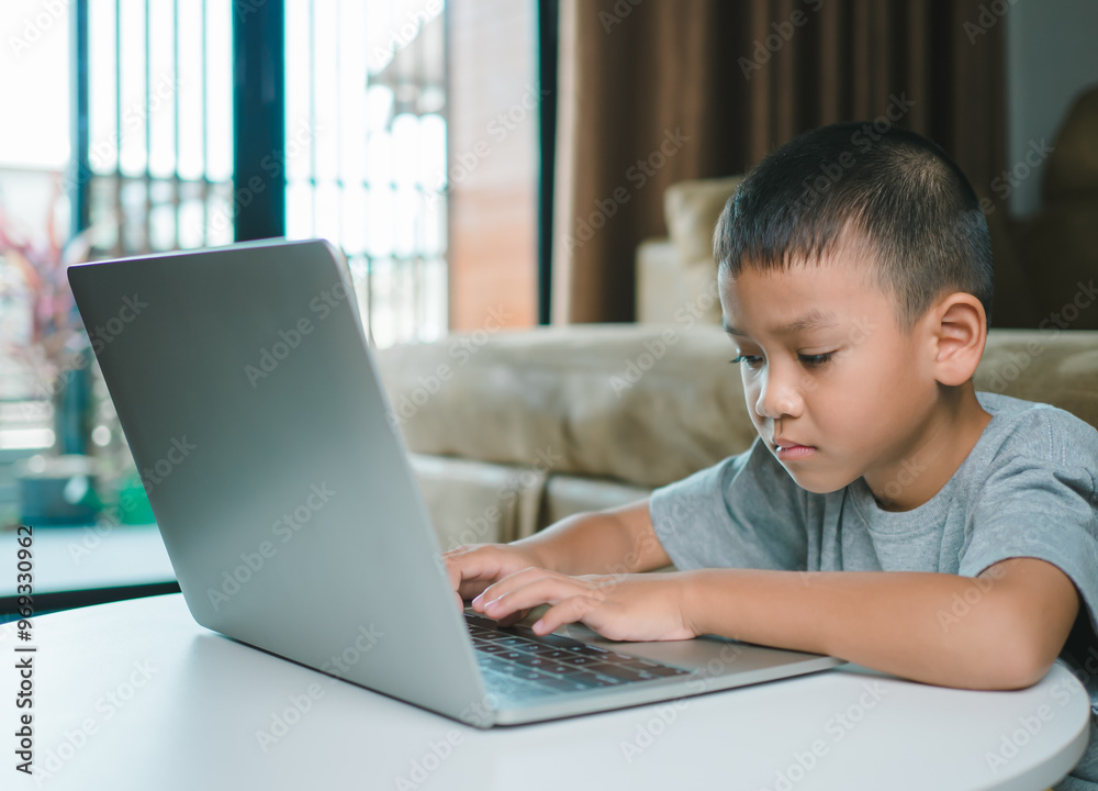 Technology studying at home using laptop computer, Student distance learning virtual distance online class on video call virtual lesson, Parent or tutor teaching child boy with remote education. Technology studying at home using laptop computer, Student distance learning virtual distance online class on video call virtual lesson, Parent or tutor teaching child boy with remote education.