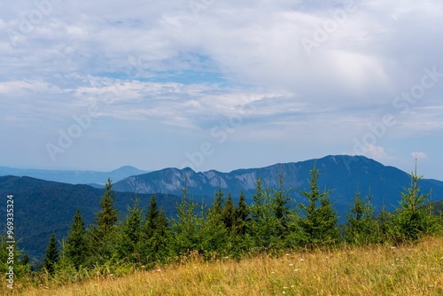 Stunning landscape featuring a mountain range under a partly cloudy sky
