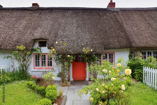 Thatched roof cottage in Adare, Ireland photo
