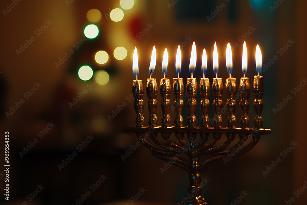 Hanukkah celebration. It is a time of family gatherings, menorah lighting, prayers and gift exchange Hanukkah celebration. It is a time of family gatherings, menorah lighting, prayers and gift exchange
