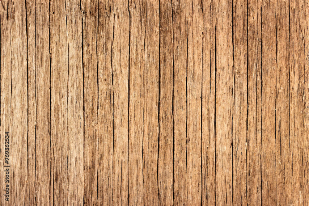 Close-up of a weathered, aged wooden surface with vertical grain patterns. Close-up of a weathered, aged wooden surface with vertical grain patterns.