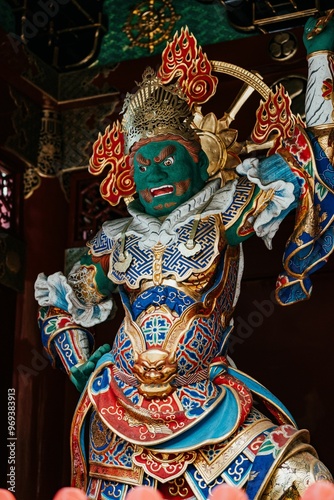 Green faced figure called Jikokuten, the Guardian of the Nation at Taiyuin Temple photo