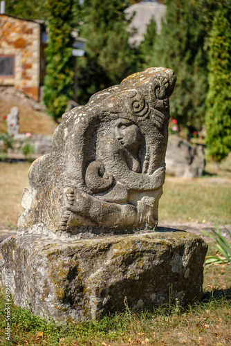 Obraz na płótnie The figure of the ancient gods on the stones in the autumn park. Ukraine. Scythian culture w salonie