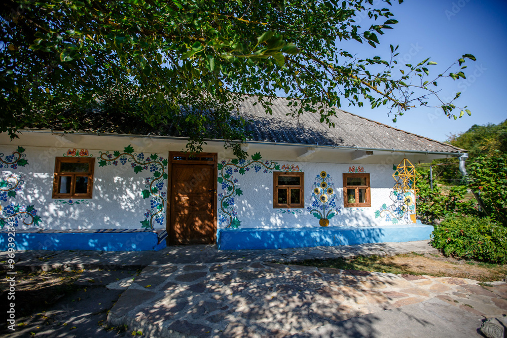 Ukrainian house painted with floral patterns in ancient technique