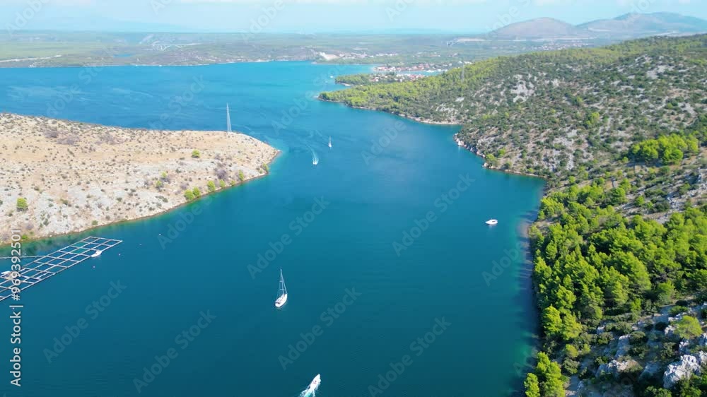 An aerial view of the stunning Krka Canyon located between Šibenik and Bilice in Croatia. The canyon winds through lush landscapes and dramatic cliffs, with the Krka River An aerial view of the stunning Krka Canyon located between Šibenik and Bilice in Croatia. The canyon winds through lush landscapes and dramatic cliffs, with the Krka River