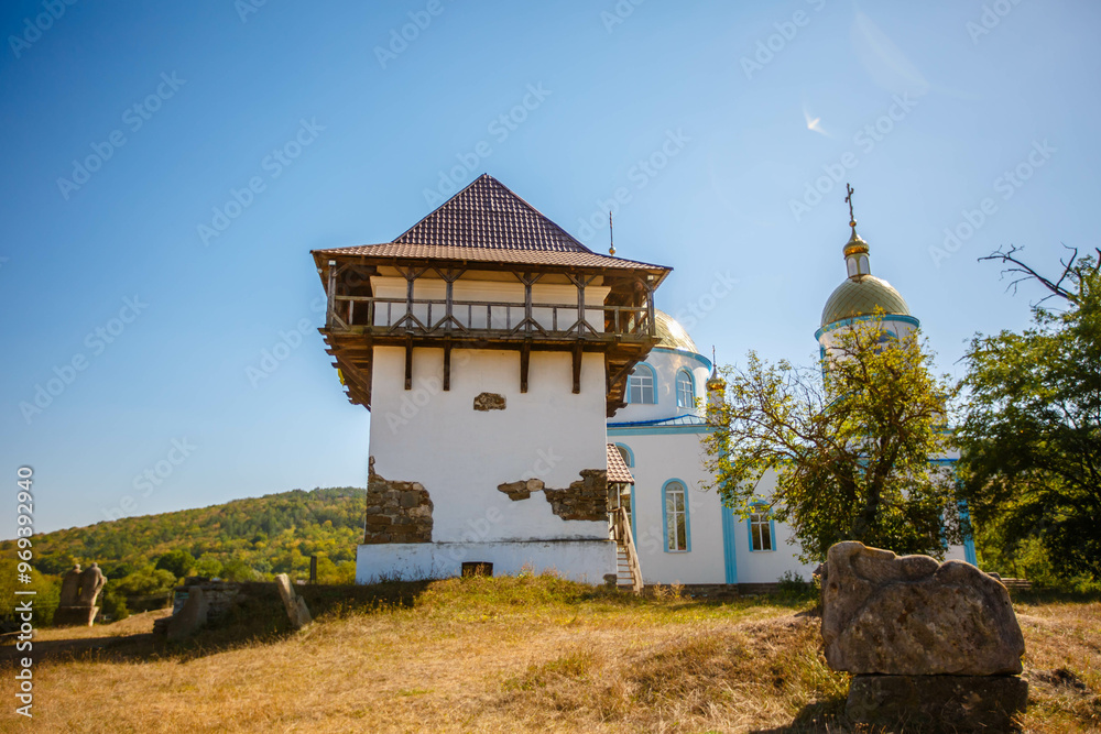 Blue Church and Old Tower in an open air nature reserve. Busha village. Ukraine