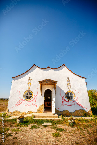 Ukrainian house painted with floral patterns in ancient technique