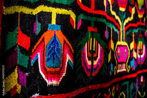 Obraz na płótnie Ornament of traditional Ukrainian multicolored colorful rug. Hutsul ethnic woven smooth hand-woven wool rug with geometric ornaments background and texture. Detail of authentic local motif carpet. w salonie