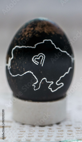Obraz na płótnie Painted traditional Ukrainian Easter egg - Pysanka. Military style. War in Ukraine w salonie