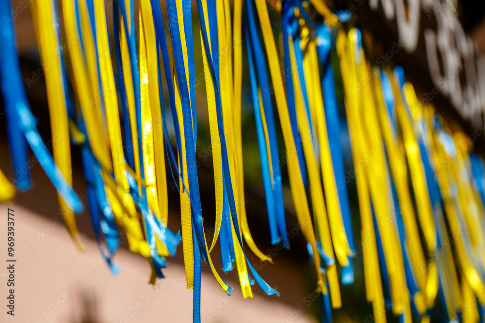 Colorful blue and yellow ribbons through the sun's rays