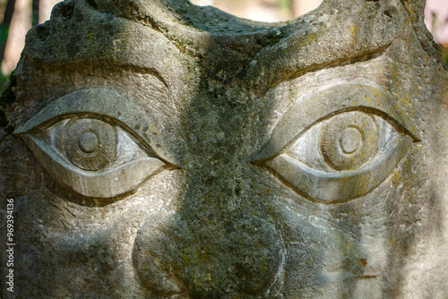 The figure of the ancient gods on the stones in the autumn park. Ukraine. Scythian culture