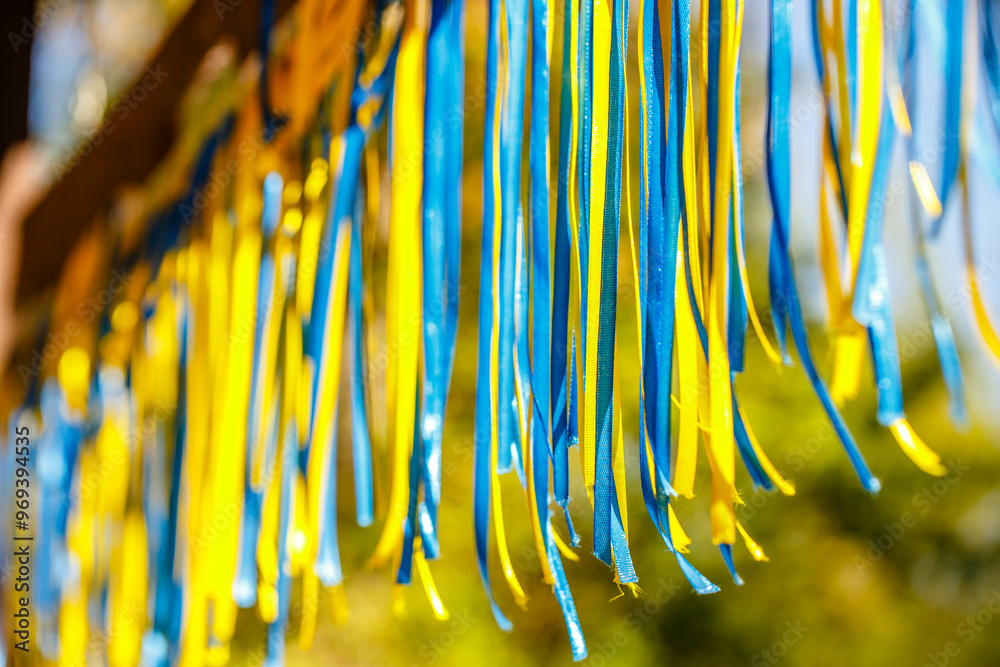 Colorful blue and yellow ribbons through the sun's rays