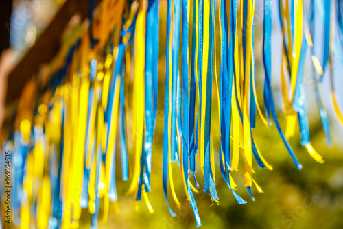 Obraz na płótnie Colorful blue and yellow ribbons through the sun's rays w salonie