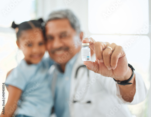 Happy doctor, child and cure with vial for vaccine, medicine or antiobiotic at hospital. Closeup, hand or medical employee with kid, little girl or small bottle for vaccination or injection at clinic photo