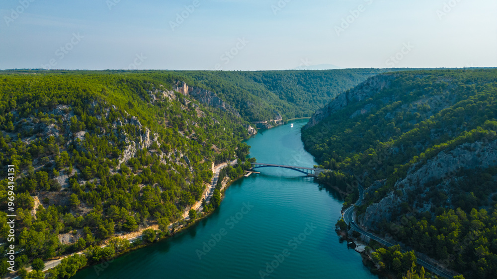 Obraz premium An aerial view of Skradin, a charming town near Krka National Park in Croatia. Nestled along the Krka River, the town features a picturesque marina filled with yachts and boats.