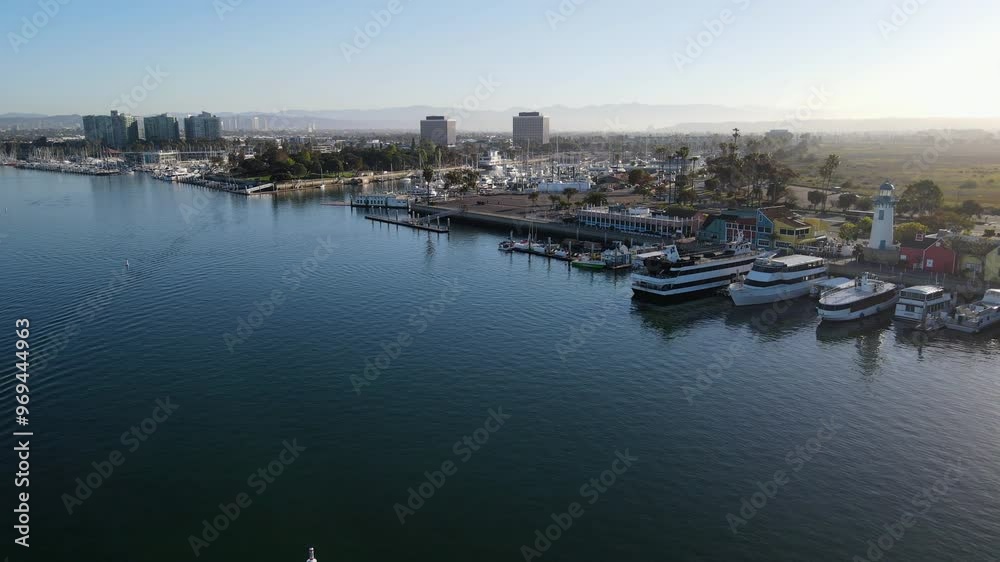 Aerial view of a solo rower exercising early in the morning on a body of water in Long Beach Aerial view of a solo rower exercising early in the morning on a body of water in Long Beach