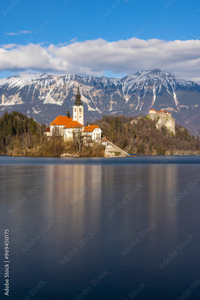 Bled lake with Bled catle, church and winter Julian Alps at background Bled lake with Bled catle, church and winter Julian Alps at background