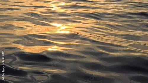 Waves and a beautiful sunset reflection on sea