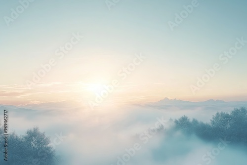 A serene sunrise above a foggy landscape, casting soft light over mist-covered hills and trees, evoking calm and tranquility.