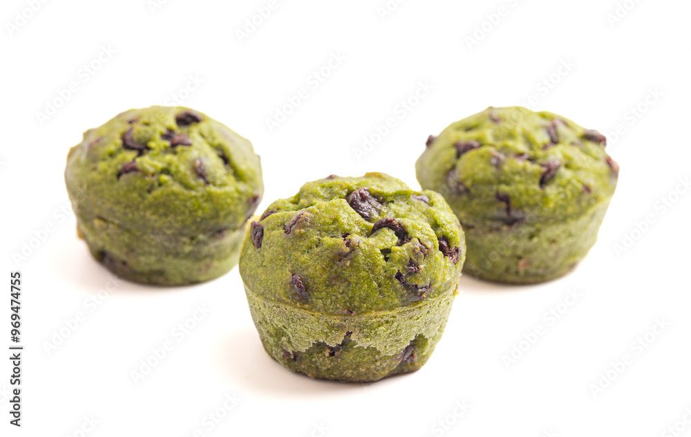 Bright Green Spinach Chocolate Chip Mini Muffins Isolated on a White Background Bright Green Spinach Chocolate Chip Mini Muffins Isolated on a White Background